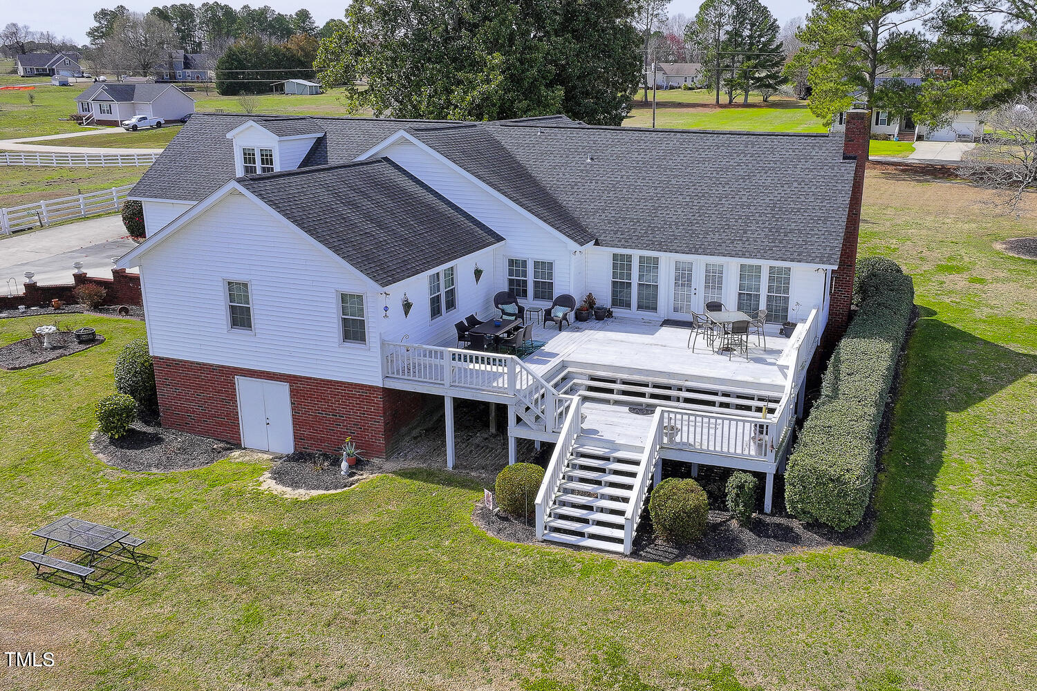 195 Williams Road Coats, NC 27521 - Photo 87 of 100 an aerial view of a house with swimming pool and deck