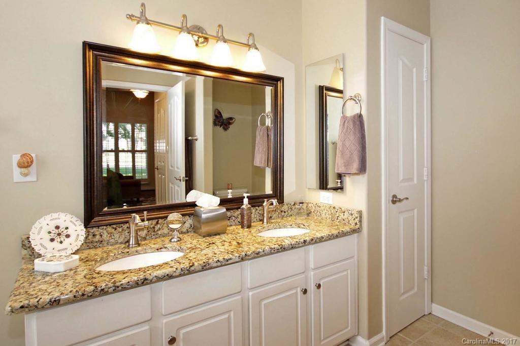 153 Kilborne Road Mooresville, NC 28117 - Photo 13 of 24 a bathroom with a granite countertop sink and a mirror