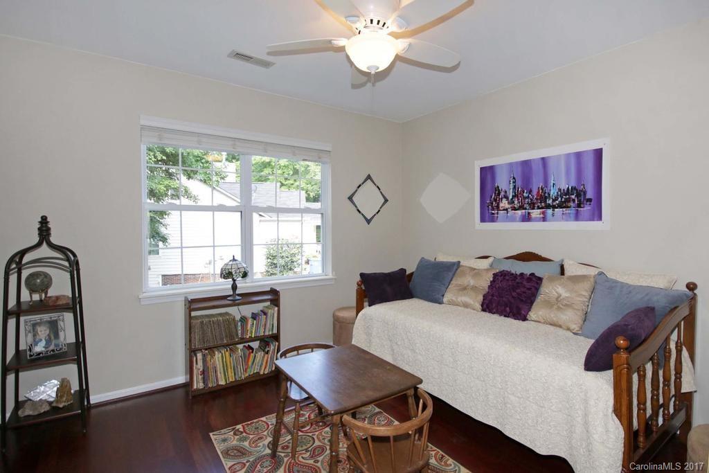 153 Kilborne Road Mooresville, NC 28117 - Photo 15 of 24 a view of a dining room with furniture window and wooden floor