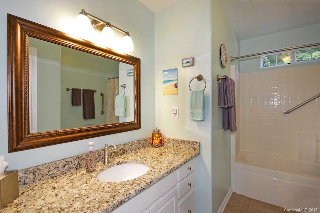 153 Kilborne Road Mooresville, NC 28117 - Photo 16 of 24 a bathroom with a granite countertop sink vanity and mirror