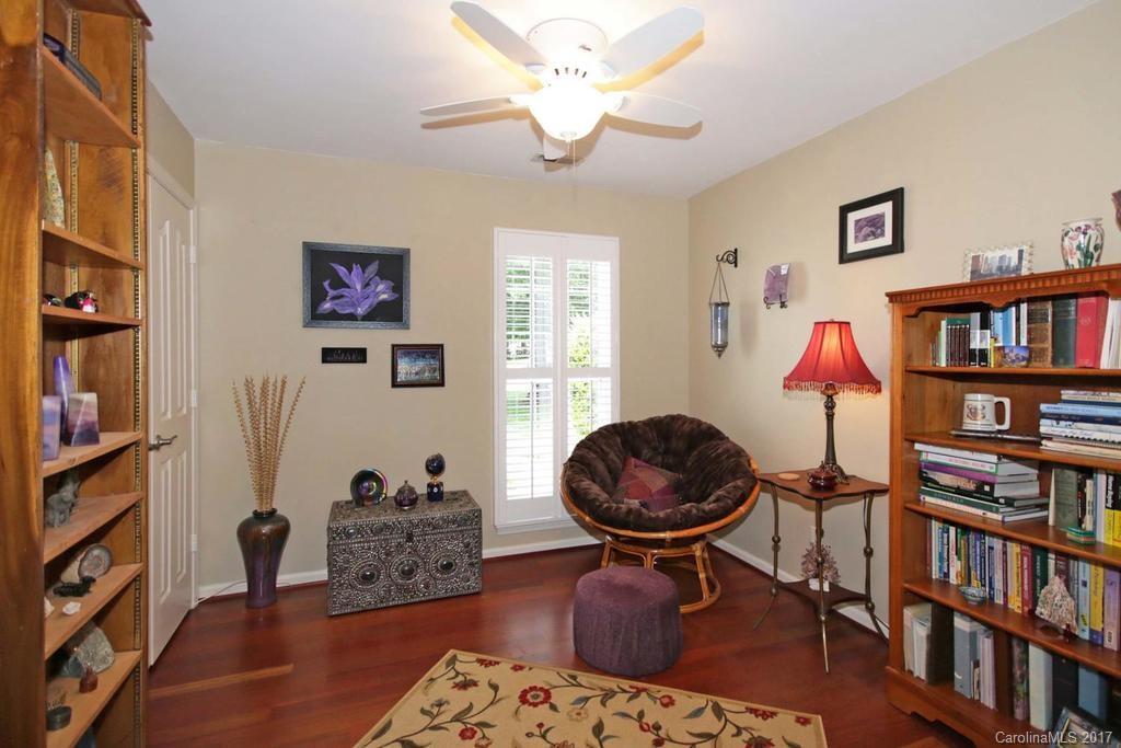 153 Kilborne Road Mooresville, NC 28117 - Photo 18 of 24 a living room with furniture and a book shelf