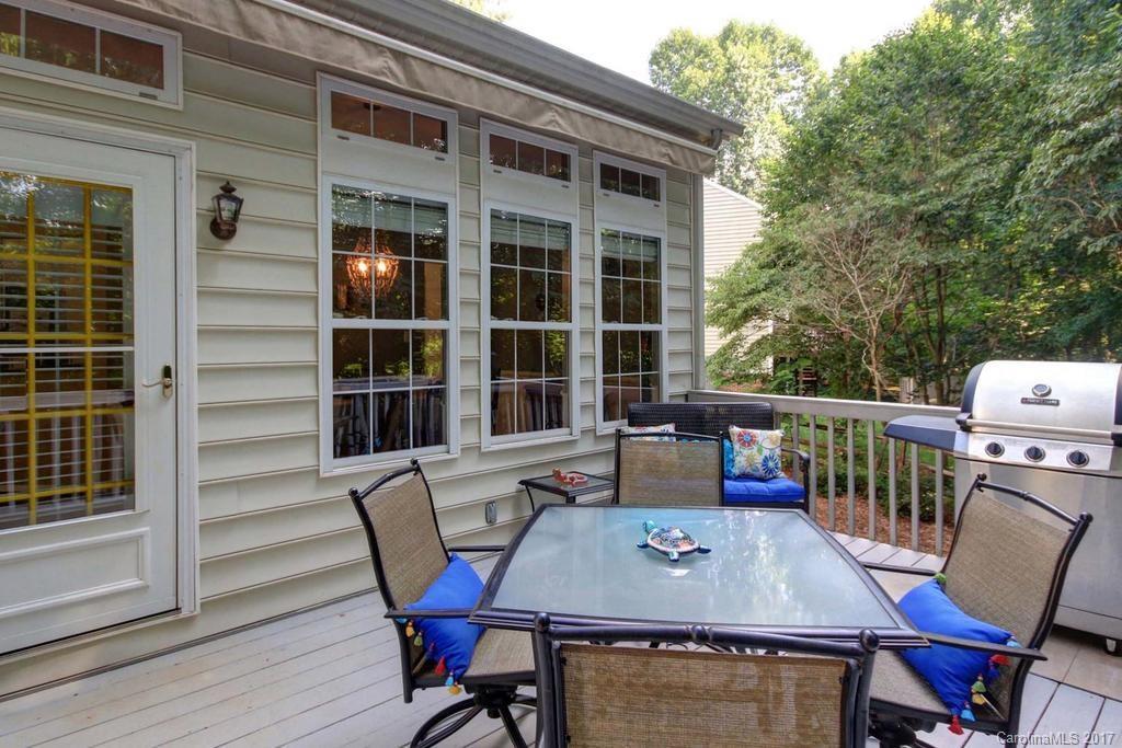 153 Kilborne Road Mooresville, NC 28117 - Photo 21 of 24 a view of a dining room with furniture window and wooden floor