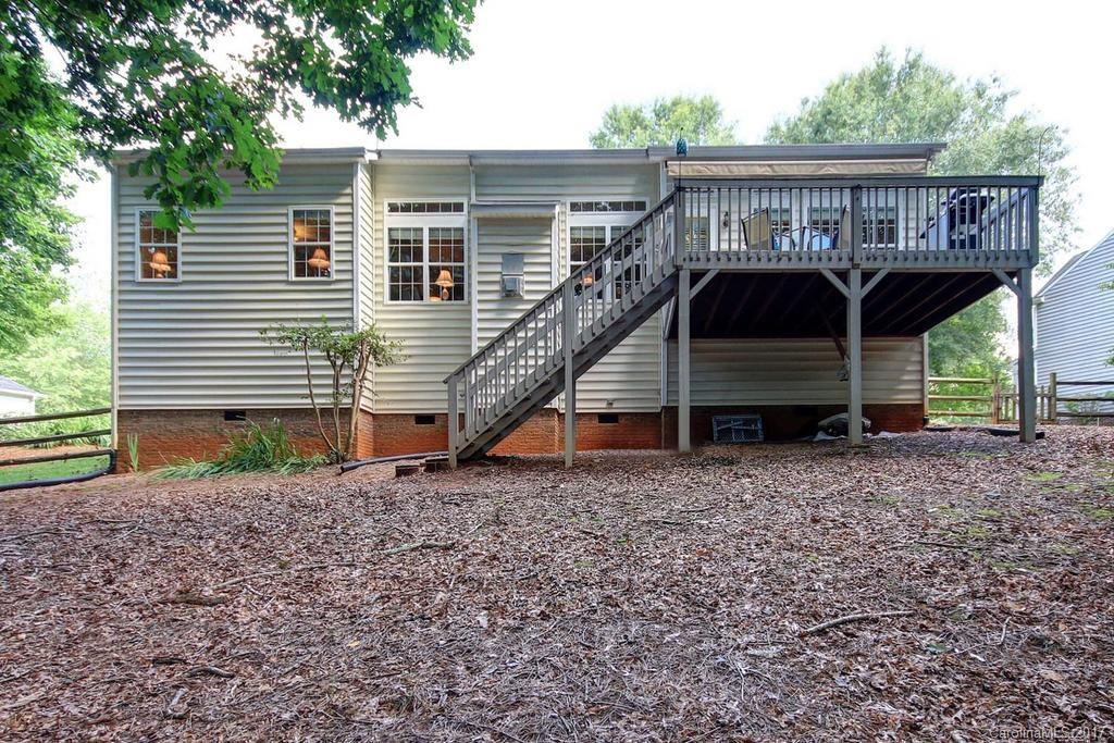 153 Kilborne Road Mooresville, NC 28117 - Photo 22 of 24 a view of a house with a yard and furniture