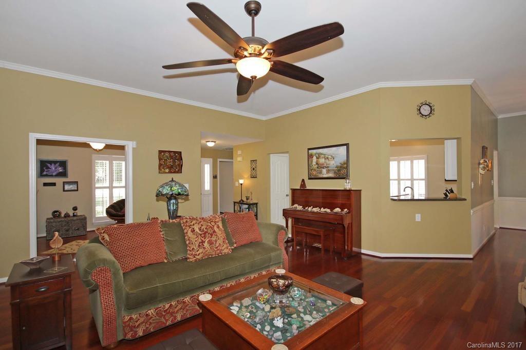 153 Kilborne Road Mooresville, NC 28117 - Photo 5 of 24 a living room with furniture and wooden floor