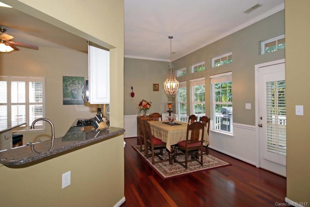 153 Kilborne Road Mooresville, NC 28117 - Photo 6 of 24 a view of a dining room with furniture window and wooden floor