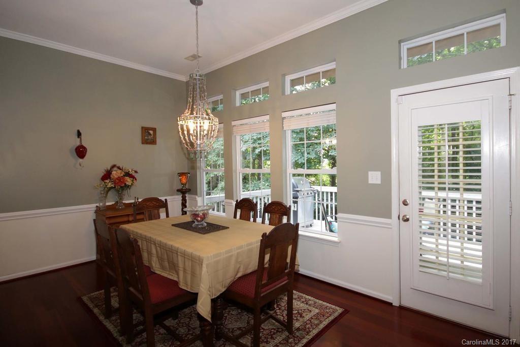 153 Kilborne Road Mooresville, NC 28117 - Photo 7 of 24 a view of a dining room with furniture window and wooden floor