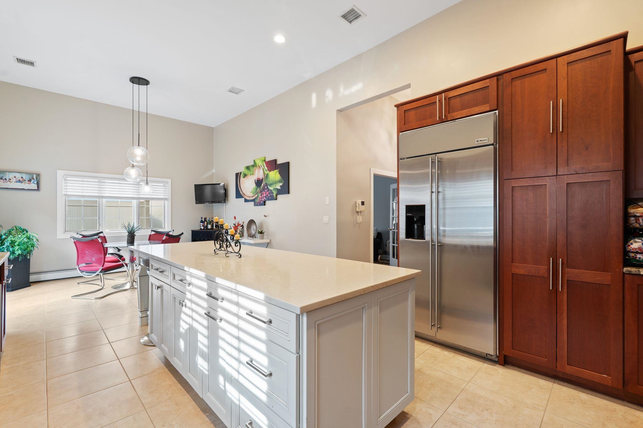 88 Myrtle Avenue, Unit B Edgewater, NJ 07020 - Photo 12 of 49 a large kitchen with a sink and refrigerator