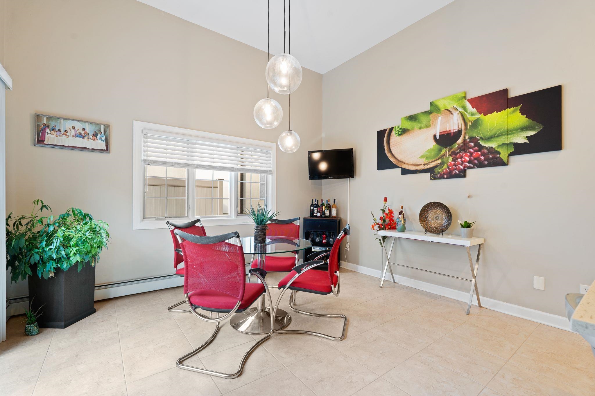 88 Myrtle Avenue, Unit B Edgewater, NJ 07020 - Photo 15 of 49 a living room with furniture and a potted plant