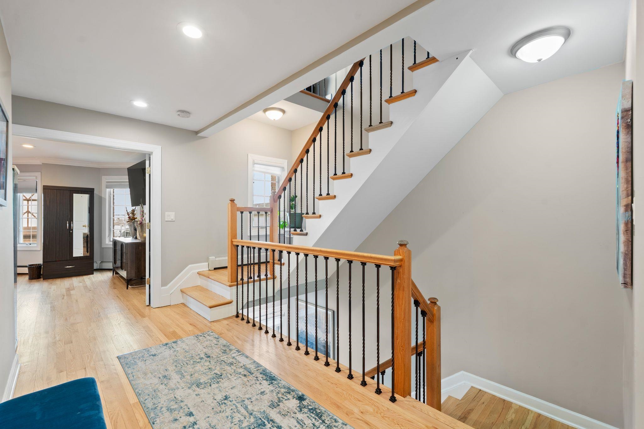 88 Myrtle Avenue, Unit B Edgewater, NJ 07020 - Photo 16 of 49 a view of staircase with railing and a rug
