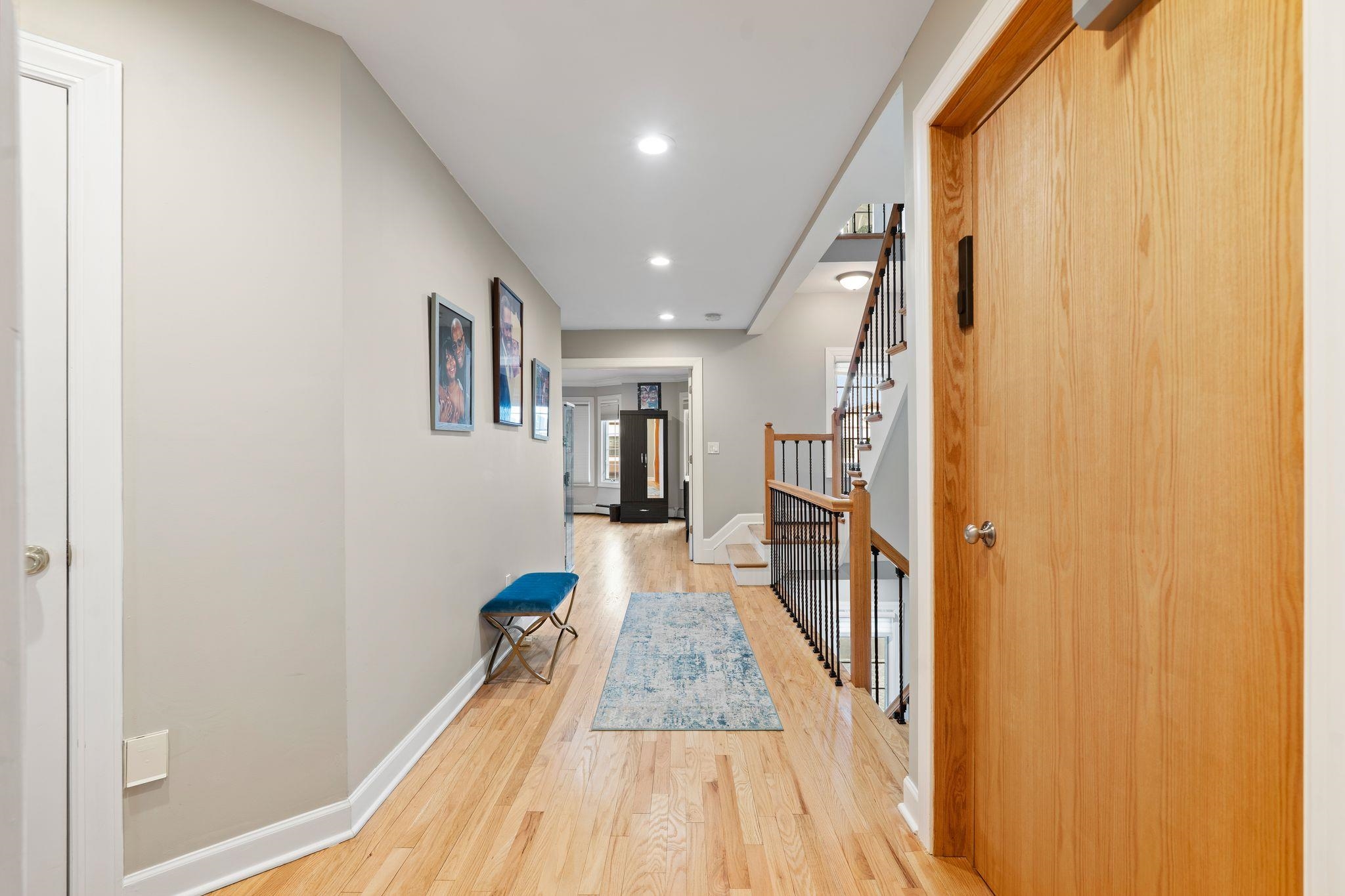 88 Myrtle Avenue, Unit B Edgewater, NJ 07020 - Photo 17 of 49 a view of a hallway with wooden floor and staircase