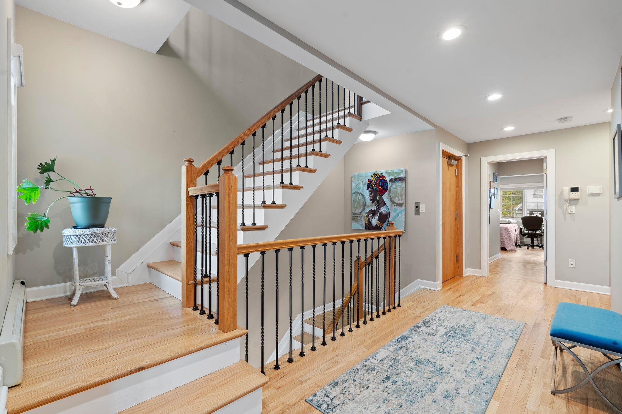 88 Myrtle Avenue, Unit B Edgewater, NJ 07020 - Photo 21 of 49 a view of a hallway with wooden floor and stairs