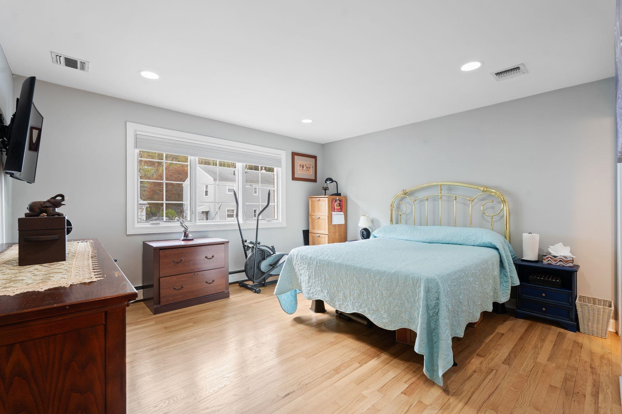 88 Myrtle Avenue, Unit B Edgewater, NJ 07020 - Photo 23 of 49 a bedroom with a bed and a desk