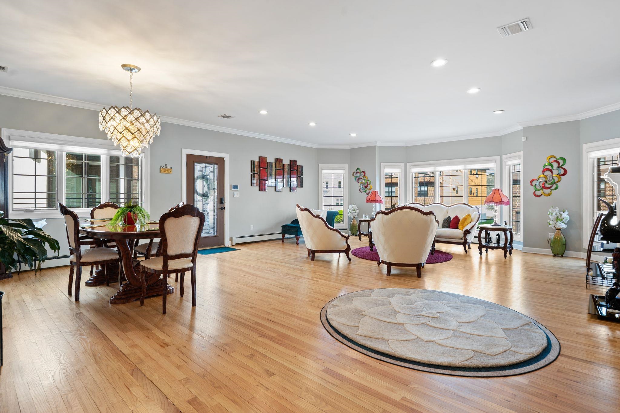 88 Myrtle Avenue, Unit B Edgewater, NJ 07020 - Photo 3 of 49 a living room with furniture a dining table and wooden floor