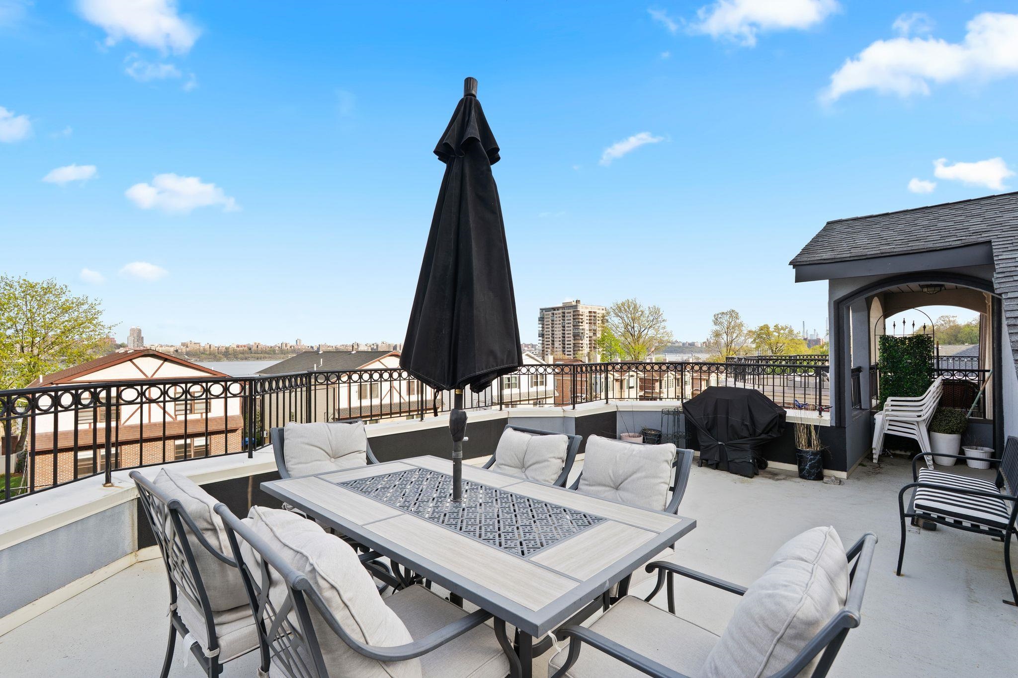 88 Myrtle Avenue, Unit B Edgewater, NJ 07020 - Photo 32 of 49 a view of a terrace with furniture