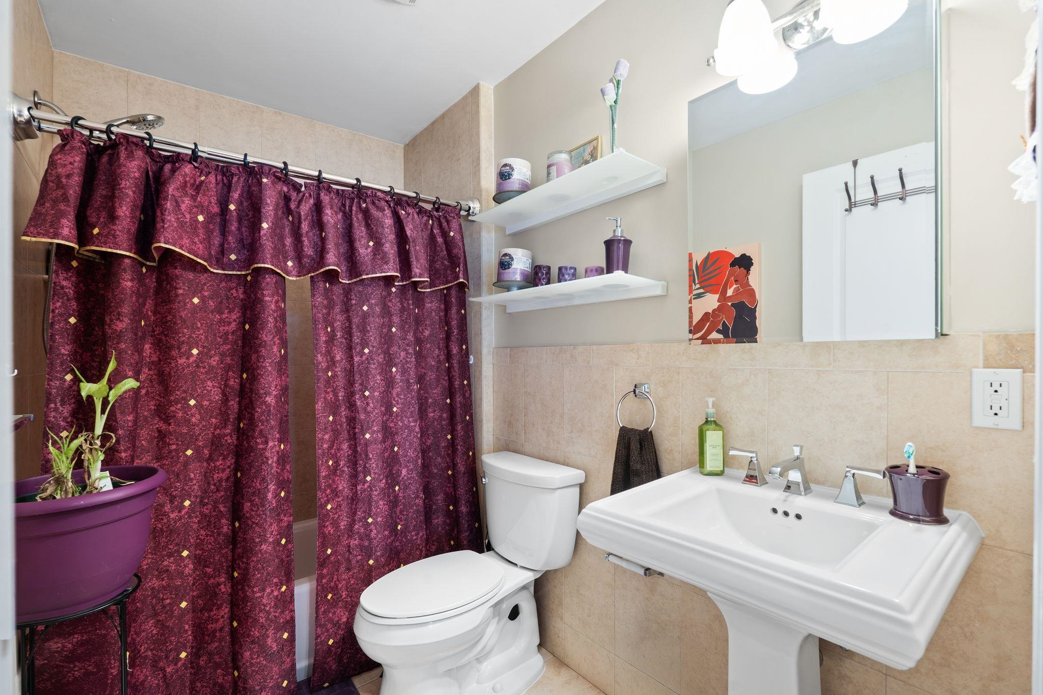 88 Myrtle Avenue, Unit B Edgewater, NJ 07020 - Photo 35 of 49 a bathroom with a sink toilet and shower