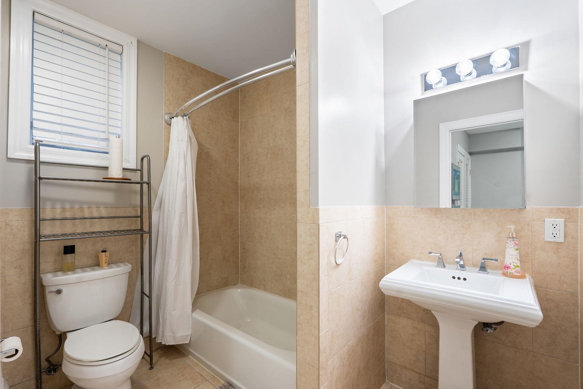 88 Myrtle Avenue, Unit B Edgewater, NJ 07020 - Photo 38 of 49 a bathroom with a sink toilet and shower