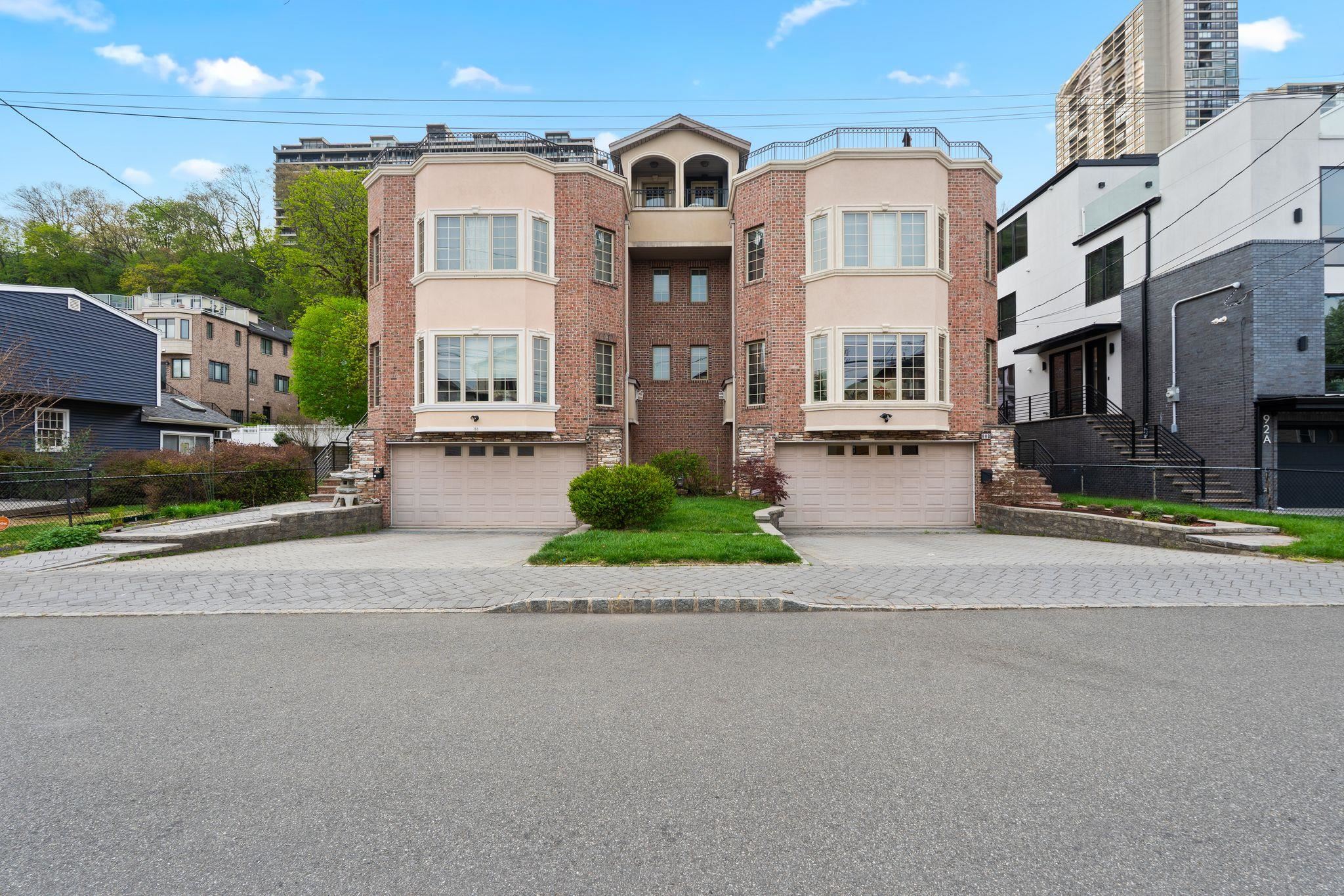88 Myrtle Avenue, Unit B Edgewater, NJ 07020 - Photo 44 of 49 a front view of a building with a street