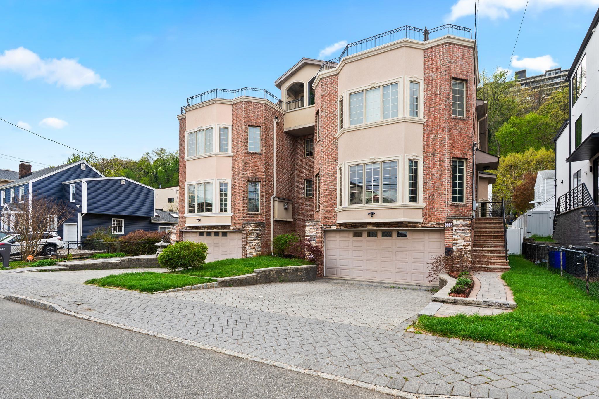88 Myrtle Avenue, Unit B Edgewater, NJ 07020 - Photo 46 of 49 a front view of a house with a yard