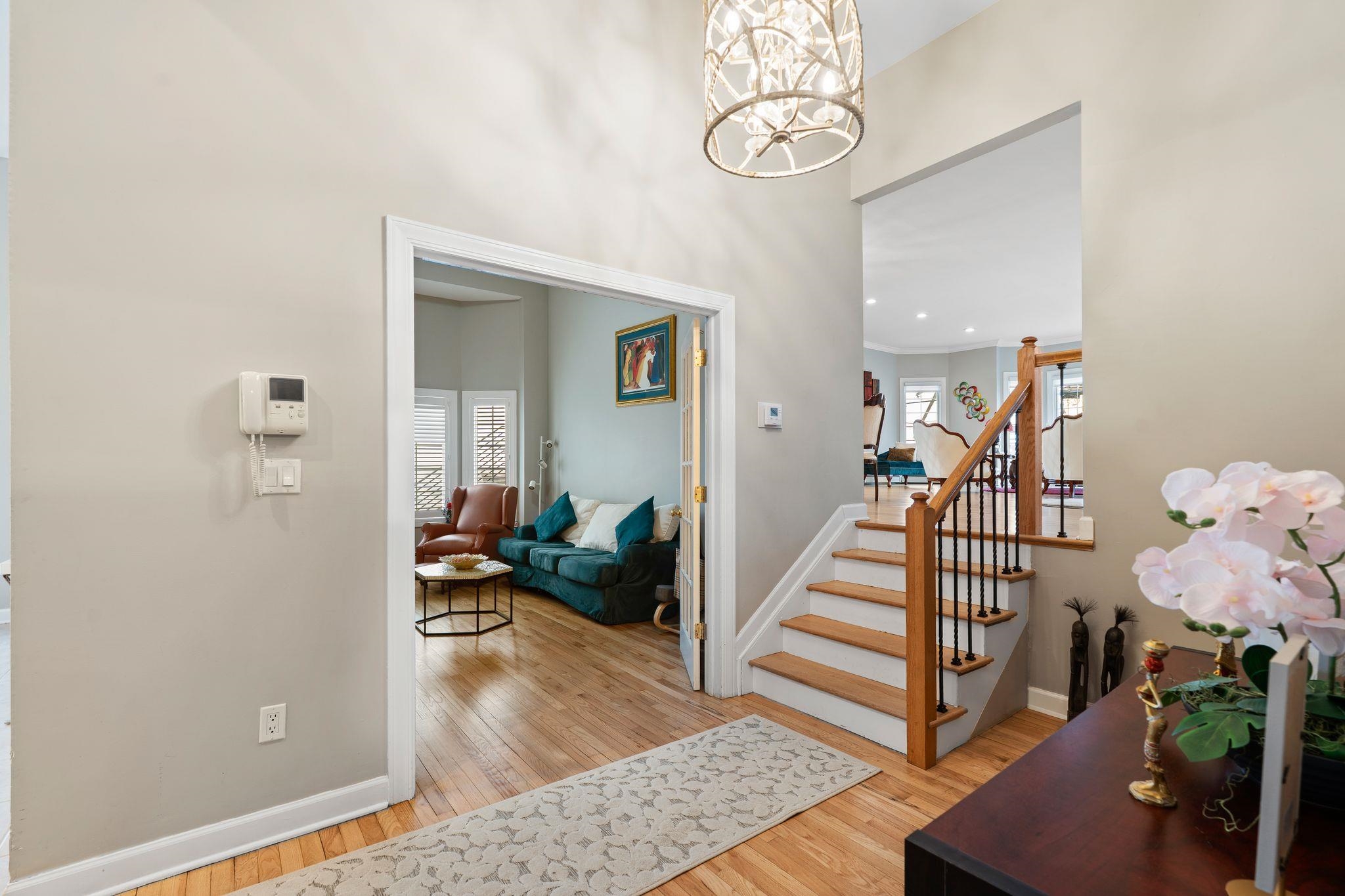 88 Myrtle Avenue, Unit B Edgewater, NJ 07020 - Photo 6 of 49 a view of a hallway to a livingroom with furniture