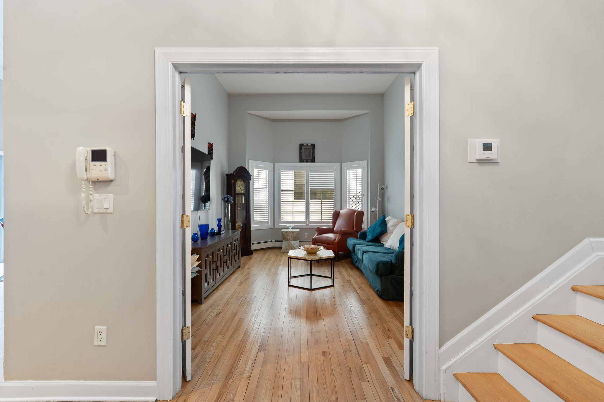 88 Myrtle Avenue, Unit B Edgewater, NJ 07020 - Photo 7 of 49 a living room with furniture and a wooden floor