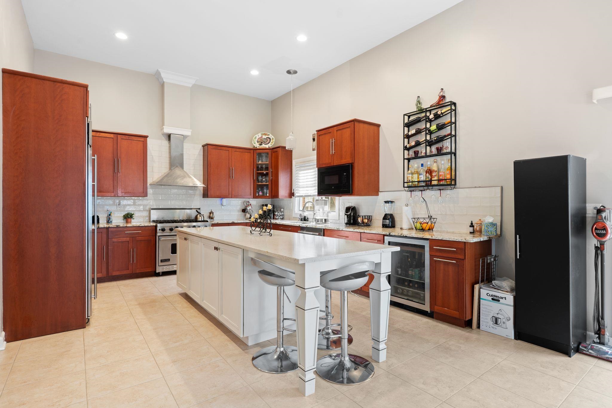 88 Myrtle Avenue, Unit B Edgewater, NJ 07020 - Photo 9 of 49 a kitchen with stainless steel appliances granite countertop a refrigerator sink and cabinets