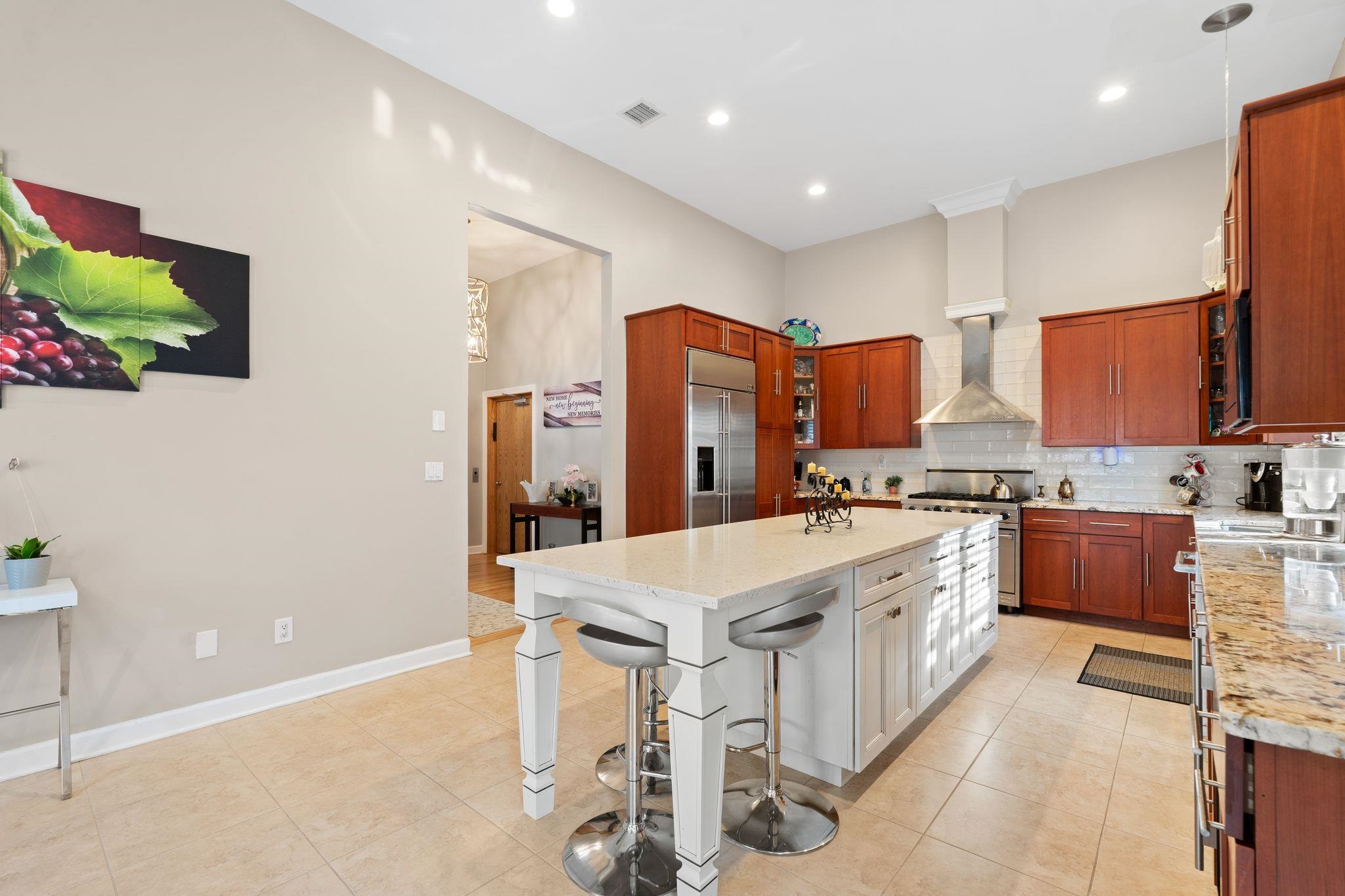 88 Myrtle Avenue, Unit B Edgewater, NJ 07020 - Photo 10 of 49 a kitchen with stainless steel appliances kitchen island granite countertop a sink and cabinets