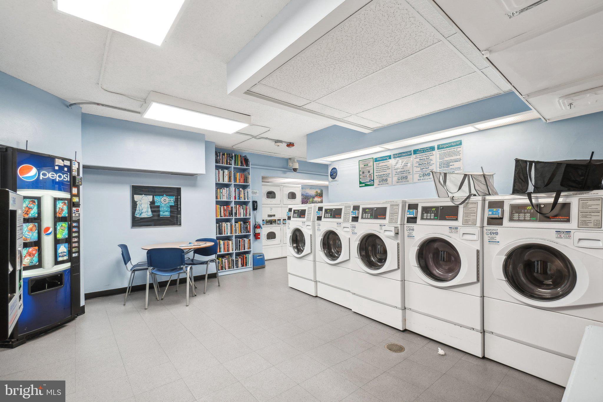 4101 Cathedral Avenue Northwest, Unit 306 Washington, DC 20016 - Photo 16 of 31 a utility room with lots of appliances and cabinets