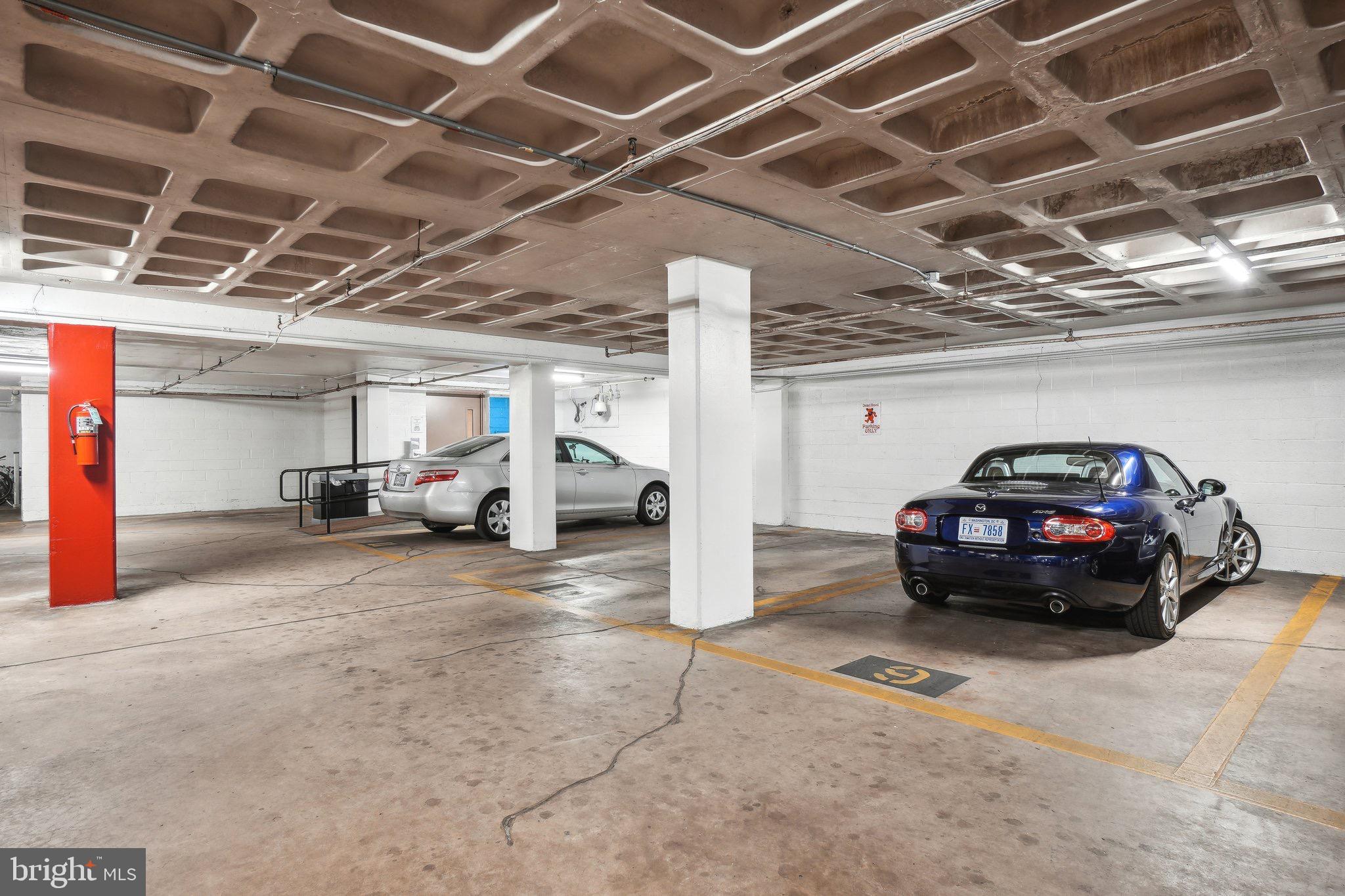 4101 Cathedral Avenue Northwest, Unit 306 Washington, DC 20016 - Photo 17 of 31 a view of parking garage with cars parked