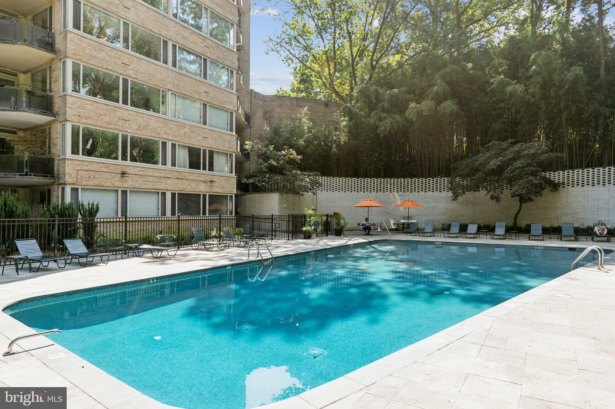 4101 Cathedral Avenue Northwest, Unit 306 Washington, DC 20016 - Photo 22 of 31 a view of a house with a backyard