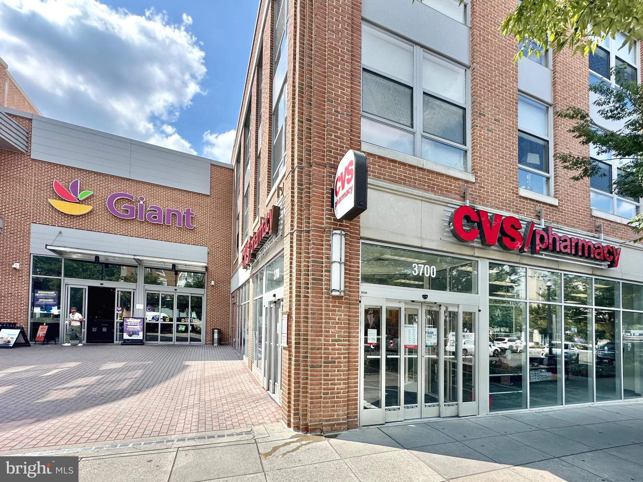 4101 Cathedral Avenue Northwest, Unit 306 Washington, DC 20016 - Photo 30 of 31 a front view of multi story building with retail shops