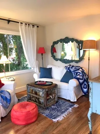 a living room with furniture and a floor to ceiling window