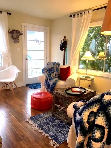 a living room with furniture and a window
