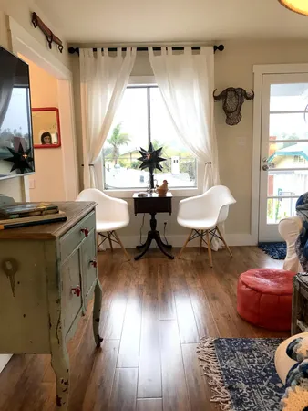 a living room with furniture and a window