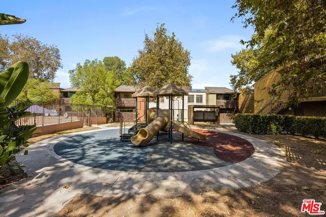 a view of a house with backyard porch and sitting area