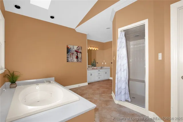 a bathroom with a tub and shower