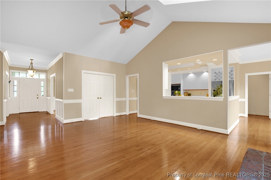 453 Kingsford Road Fayetteville, NC 28314 - Photo 13 of 50 a view of an empty room with window and wooden floor