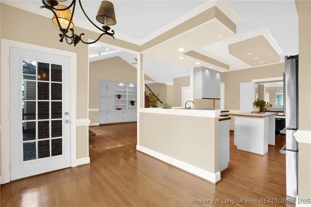 a view of kitchen with cabinets and wooden floor
