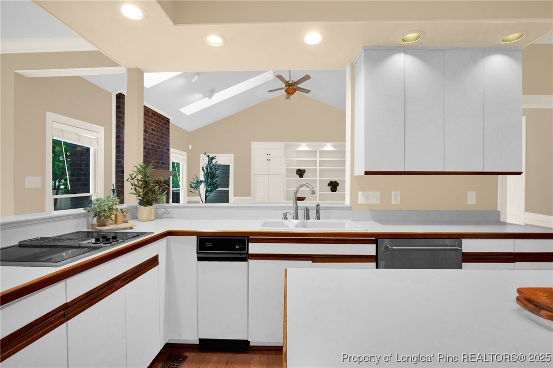 453 Kingsford Road Fayetteville, NC 28314 - Photo 19 of 50 a kitchen with a sink and chairs