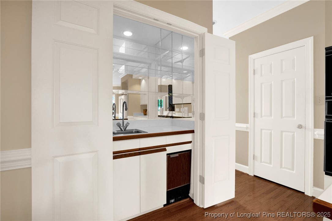 453 Kingsford Road Fayetteville, NC 28314 - Photo 24 of 50 a kitchen with kitchen island sink and refrigerator