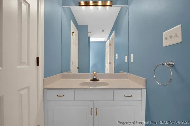 a sink sitting next to a bathroom