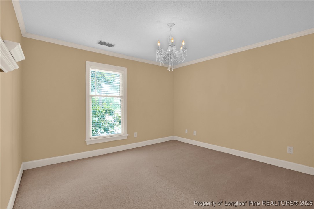 453 Kingsford Road Fayetteville, NC 28314 - Photo 32 of 50 an empty room with a window
