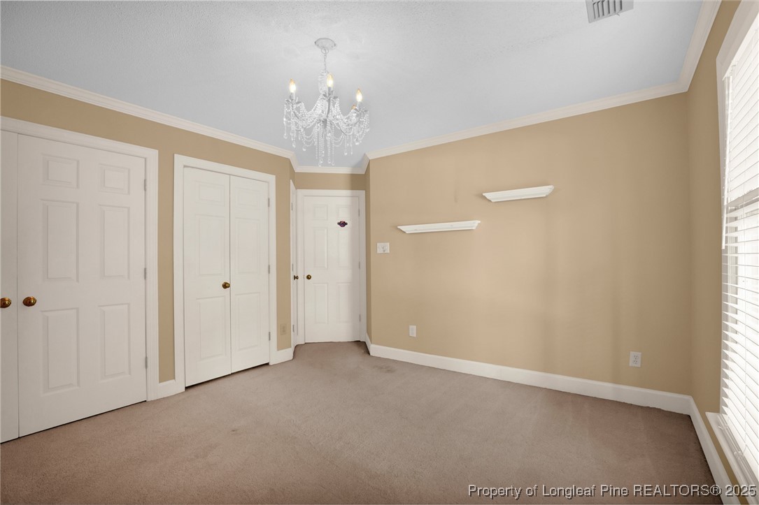 453 Kingsford Road Fayetteville, NC 28314 - Photo 33 of 50 a view of a chandelier in big room and a chandelier