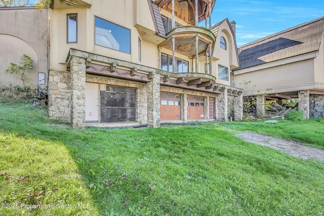 a front view of a building with garden