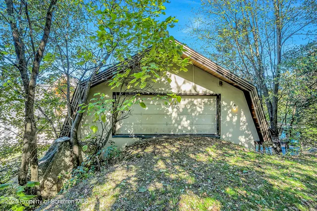 a view of a chairs and table in the patio