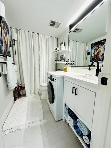 a view of bathroom with dual sinks