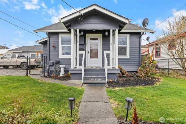 a front view of a house with garden