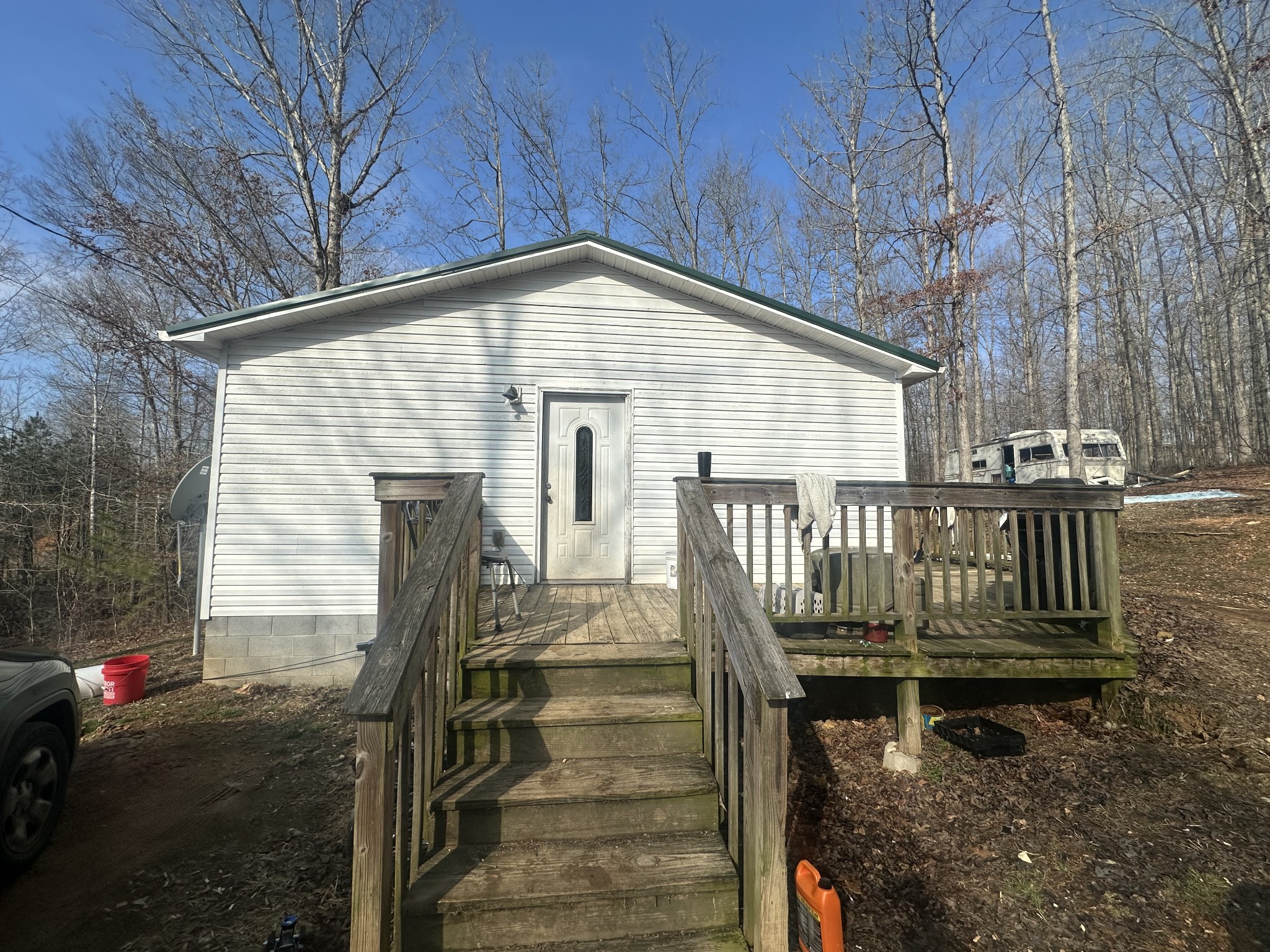 104 Clifton Road Lawrenceburg, TN 38464 - Photo 4 of 14 a view of a house with wooden deck