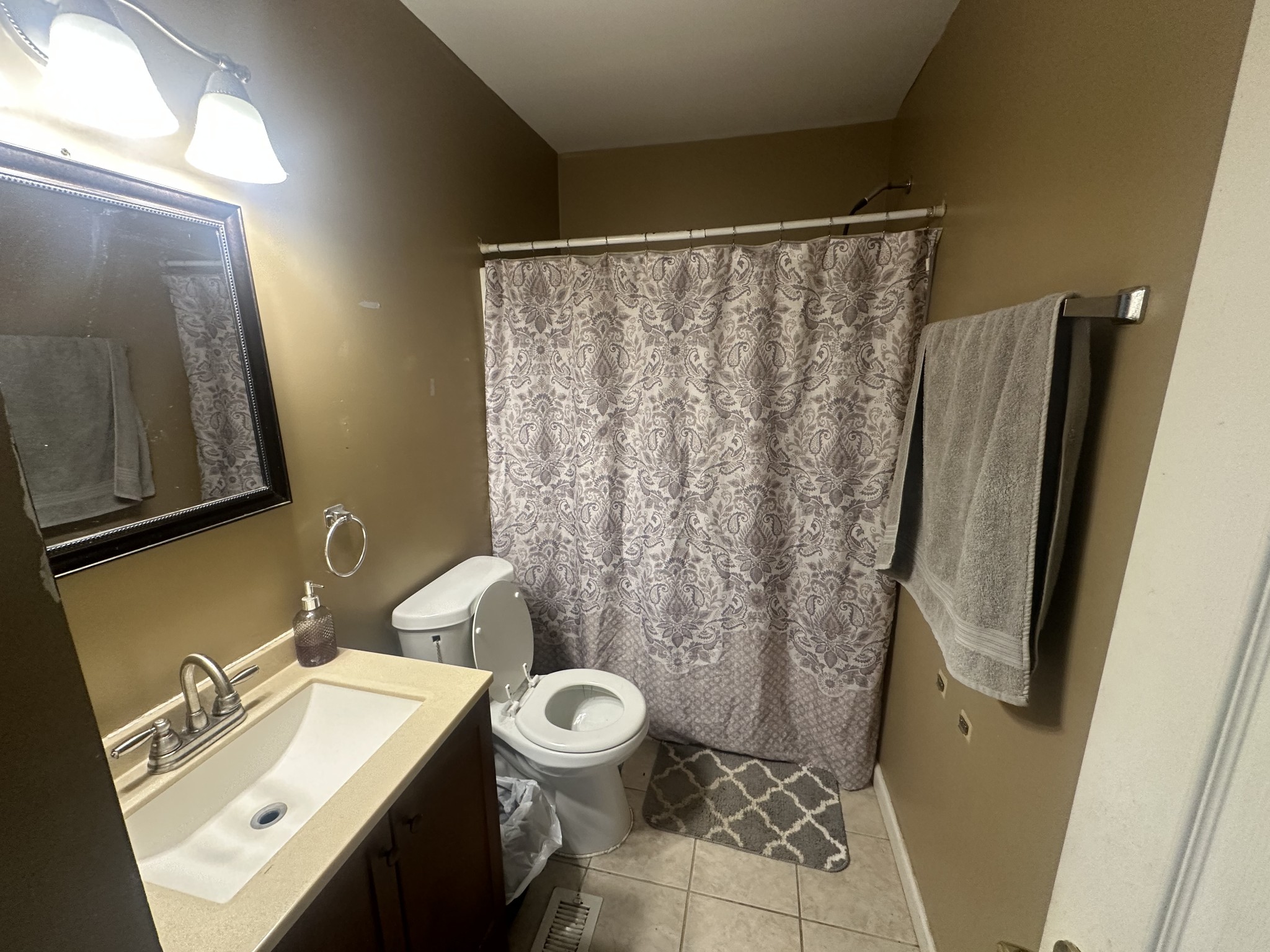 104 Clifton Road Lawrenceburg, TN 38464 - Photo 9 of 14 a bathroom with a sink toilet and shower