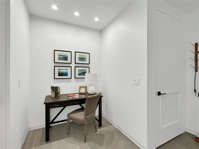 a workspace with furniture and window