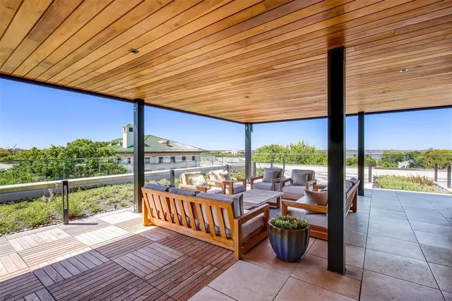 a view of a balcony with two chairs
